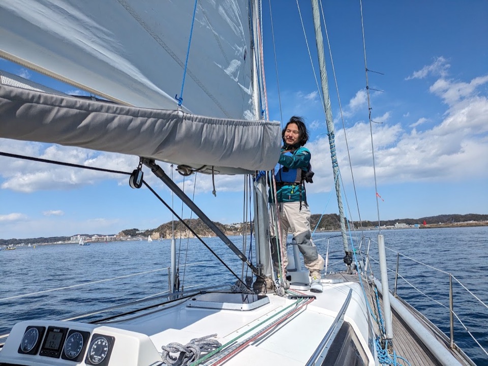 Jun Kawasaki sailing aboard a yacht